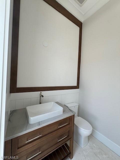 560 Rudder Road Naples, FL 34102 - Photo 17 of 23 a bathroom with a sink and a toilet
