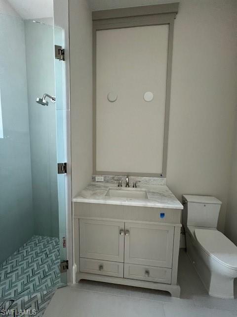 560 Rudder Road Naples, FL 34102 - Photo 22 of 23 a bathroom with a sink and a toilet