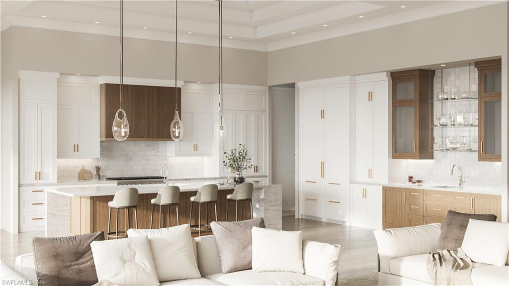 560 Rudder Road Naples, FL 34102 - Photo 4 of 23 a living room with furniture kitchen and a fireplace