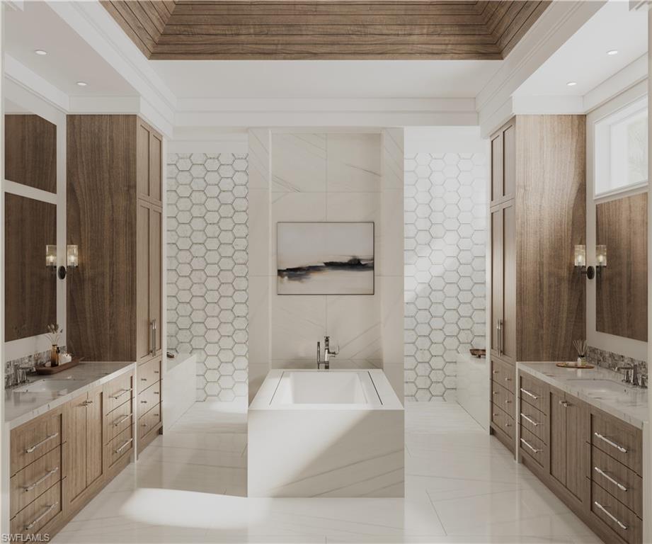 560 Rudder Road Naples, FL 34102 - Photo 7 of 23 a spacious bathroom with a bathtub shower sink and mirror