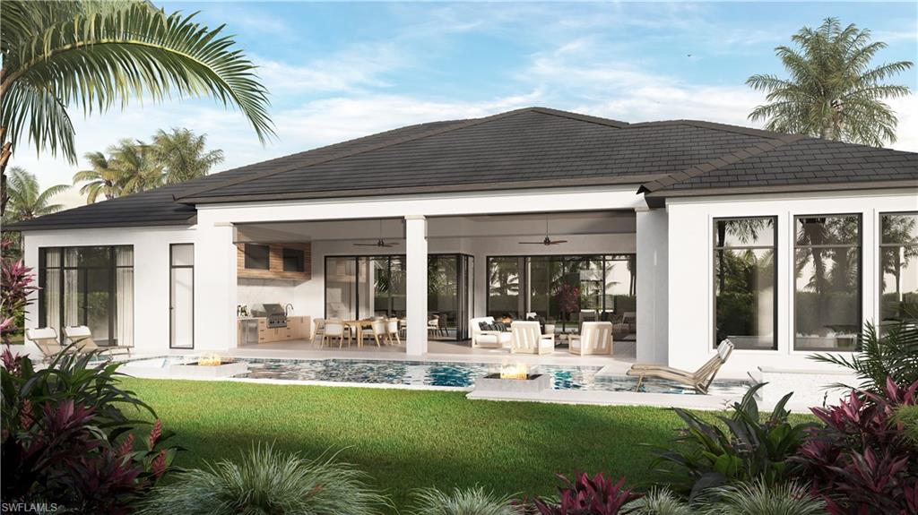 560 Rudder Road Naples, FL 34102 - Photo 9 of 23 front view of a house with a patio