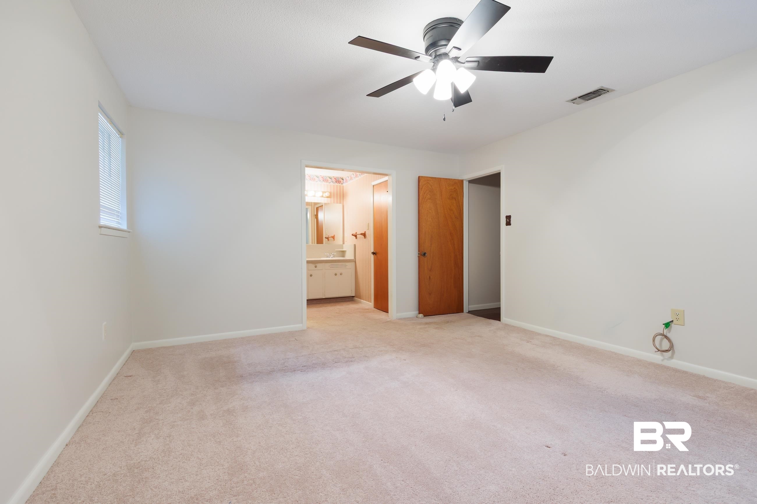 1367 Spring Valley Court Mobile, AL 36693 - Photo 16 of 29 Carpeted interior room featuring light-colored walls and a ceiling fan with integrated lighting