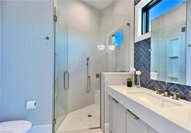 a view of a balcony with two chairs and a table