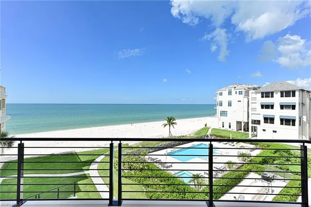 a view of a swimming pool with a yard