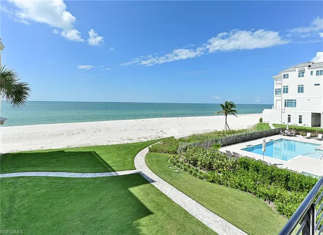 a bathroom with a granite countertop sink a toilet and a shower