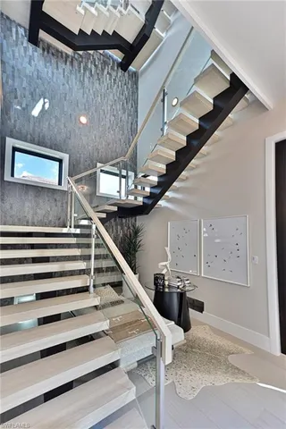 a view of a patio with couches and a potted plant on a table