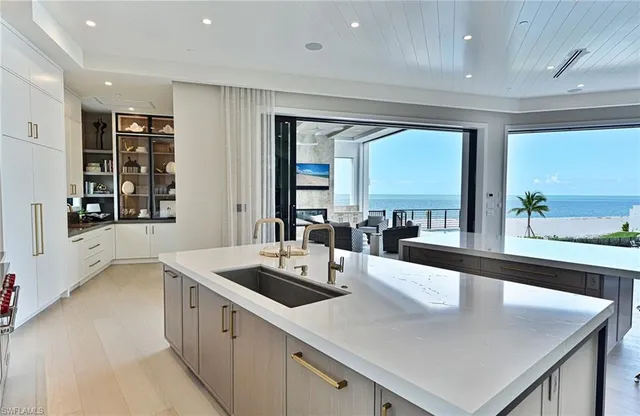 a kitchen with stainless steel appliances granite countertop a sink and a counter top space