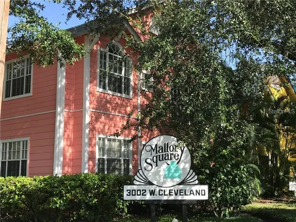 a metallic refrigerator freezer sitting in a kitchen