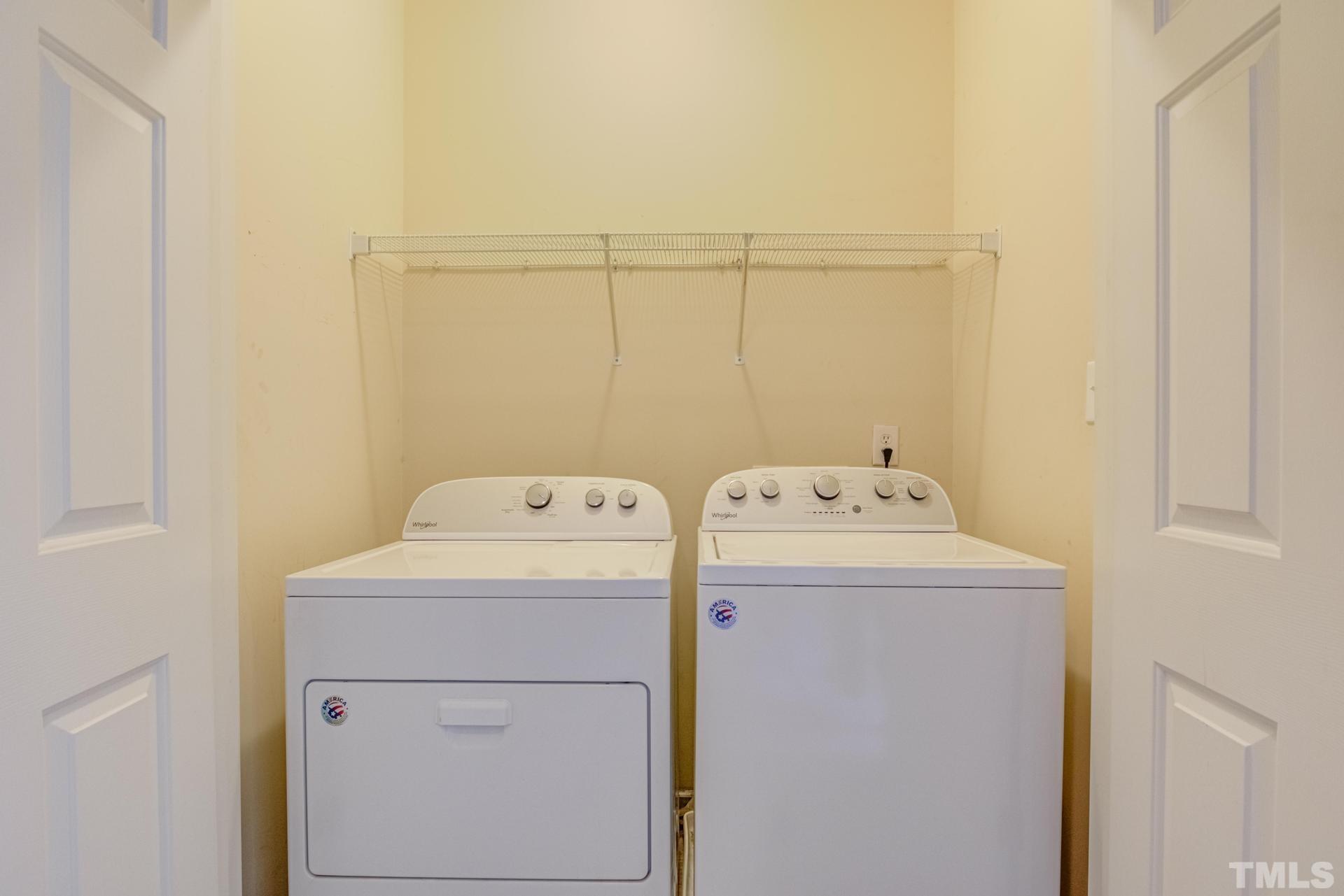 705 Glen Road, Unit 103 Garner, NC 27529 - Photo 19 of 25 a utility room with dryer and washer