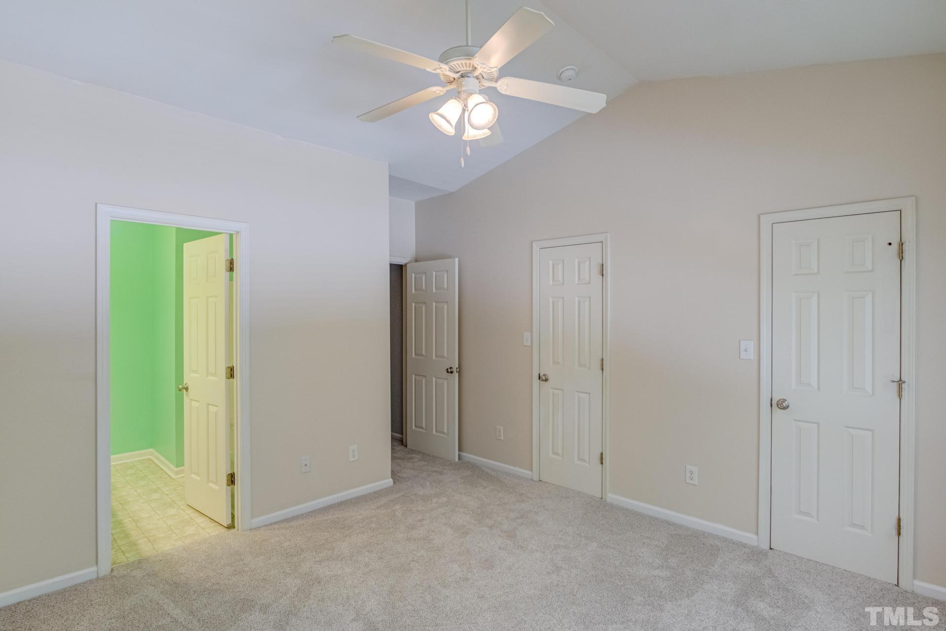 705 Glen Road, Unit 103 Garner, NC 27529 - Photo 21 of 25 a view of an empty room with a fan