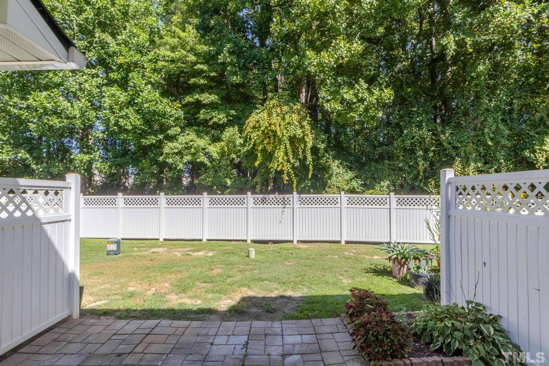 705 Glen Road, Unit 103 Garner, NC 27529 - Photo 24 of 25 a view of a backyard with a small pool and plants