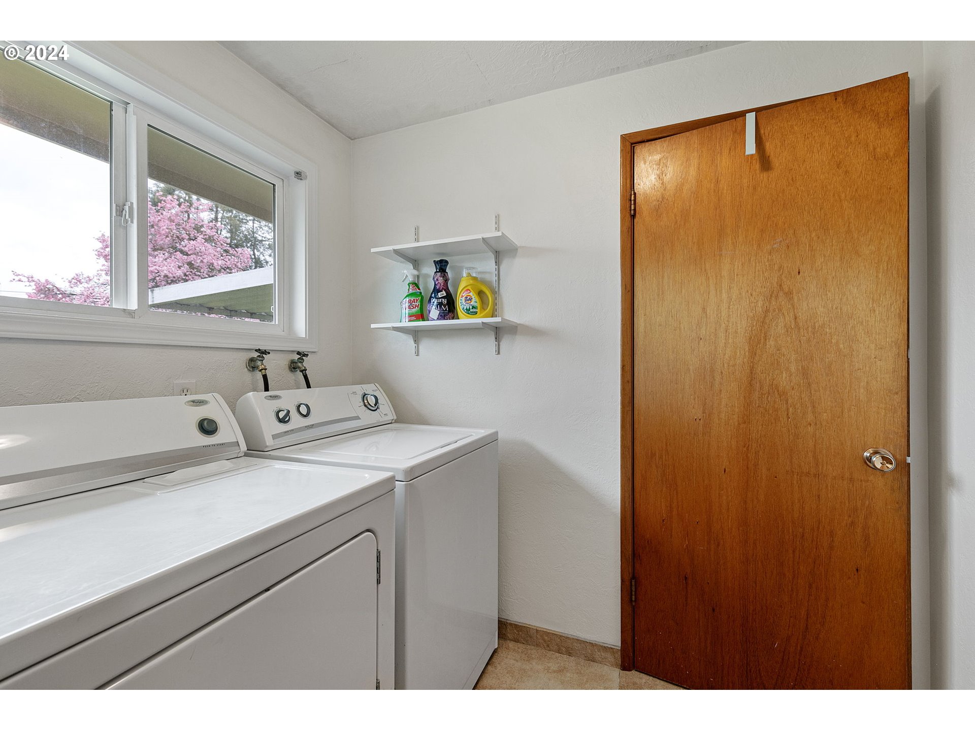 2484 19th Street Springfield, OR 97477 - Photo 14 of 30 a bathroom with a sink and a mirror