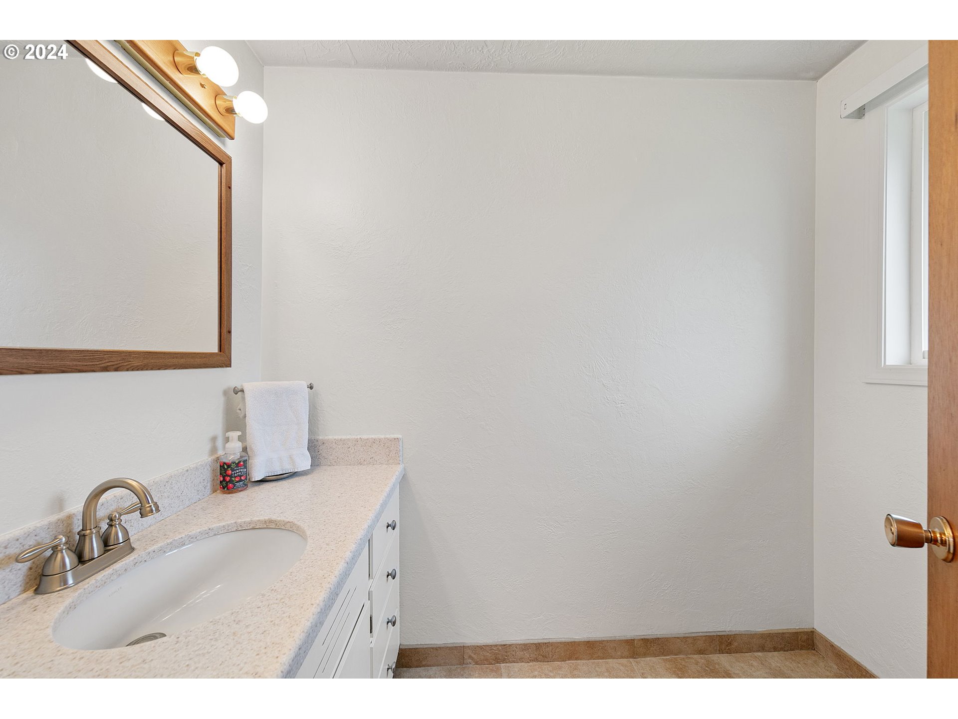 2484 19th Street Springfield, OR 97477 - Photo 15 of 30 a bathroom with a sink and a mirror