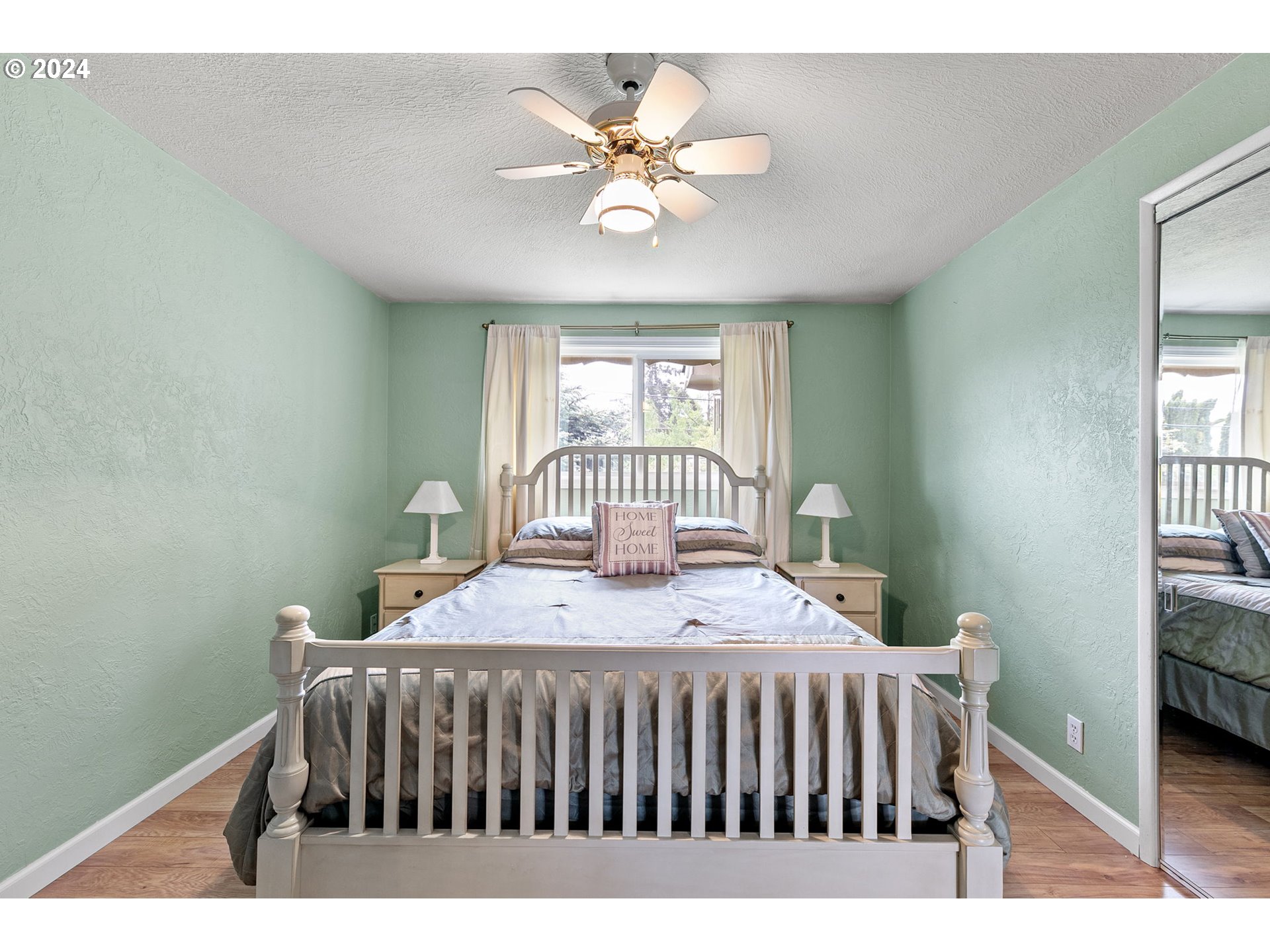 2484 19th Street Springfield, OR 97477 - Photo 17 of 30 a bedroom with a bed and a window