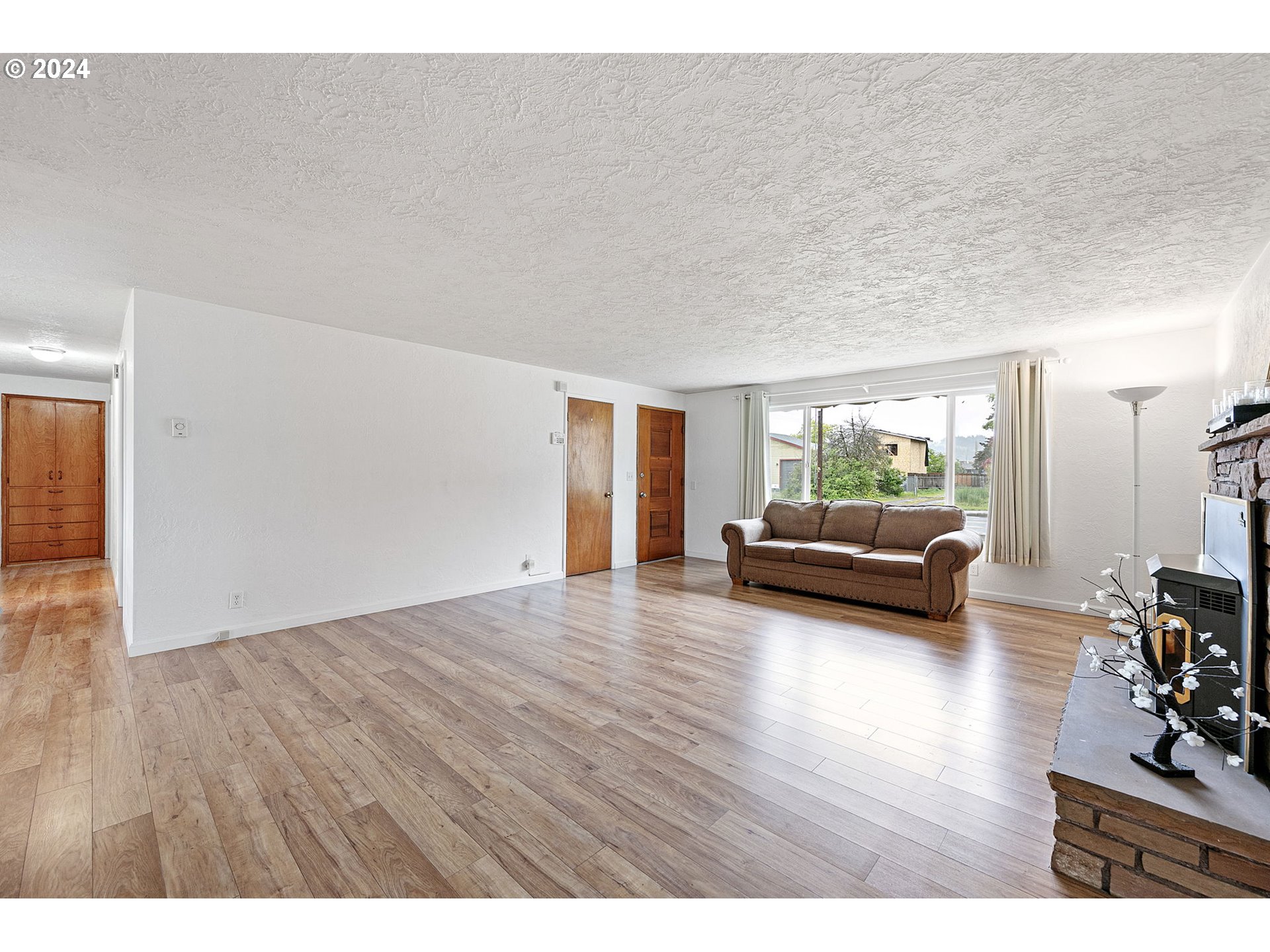 2484 19th Street Springfield, OR 97477 - Photo 5 of 30 a view of a livingroom with furniture and wooden floor