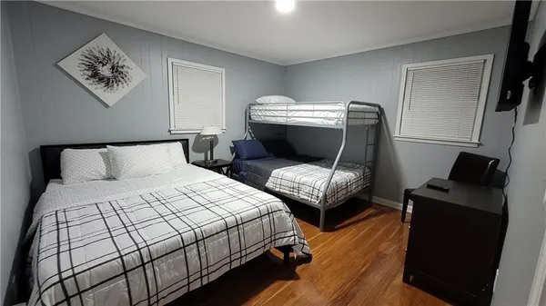 a bedroom with bed and a window