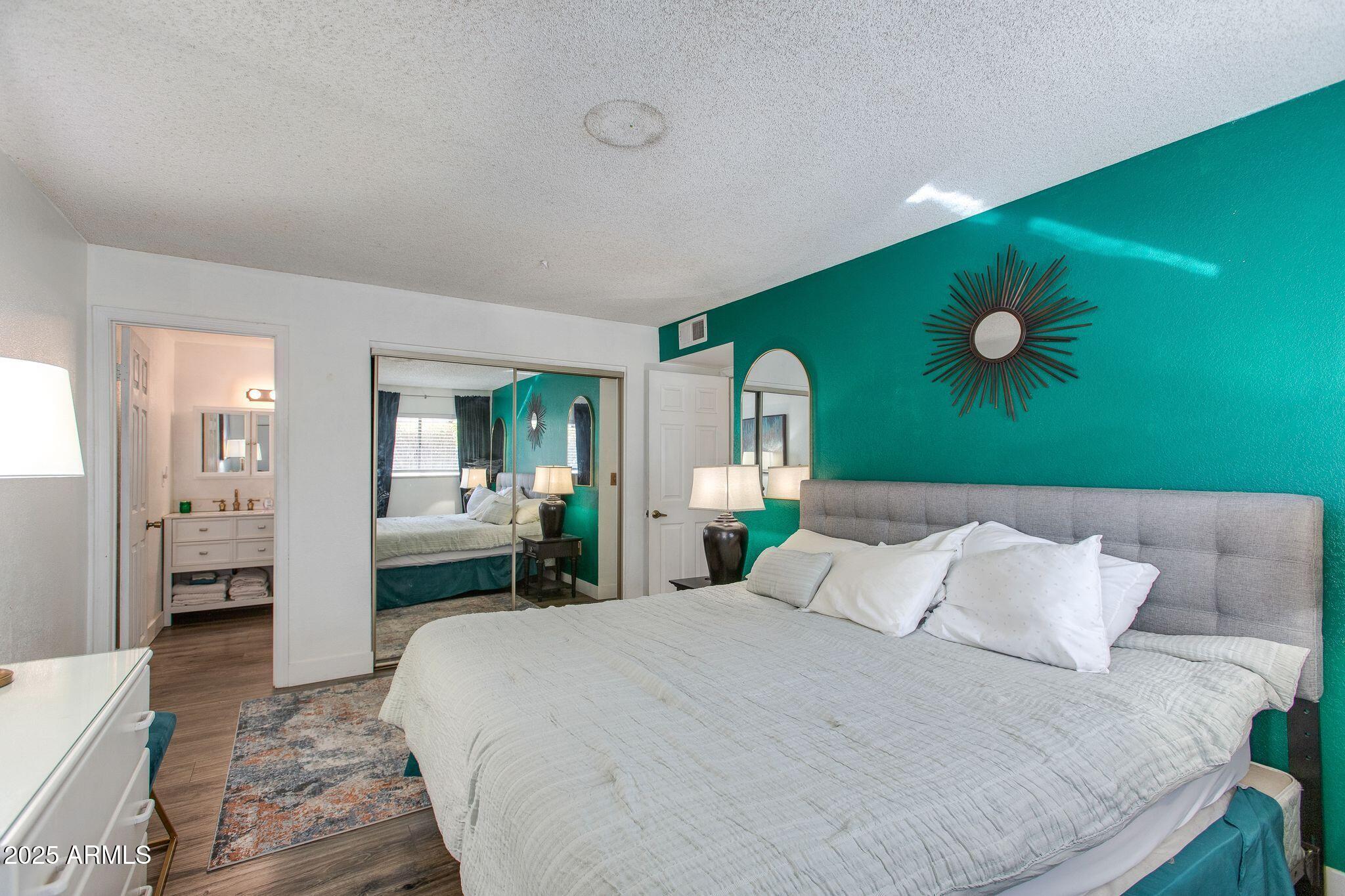 1645 West Baseline Road, Unit 1058 Mesa, AZ 85202 - Photo 33 of 44 a bedroom with a bed and window