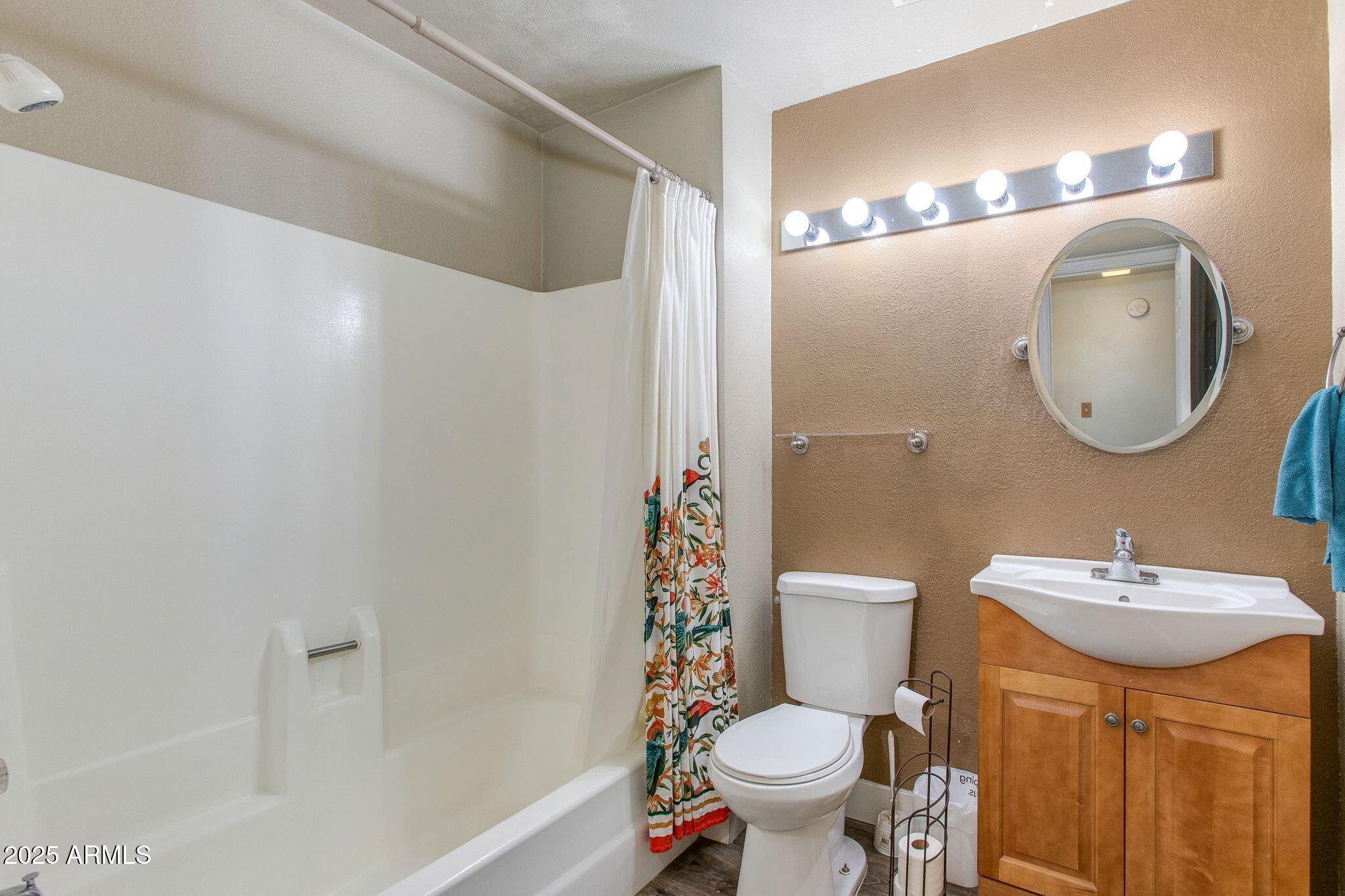 1645 West Baseline Road, Unit 1058 Mesa, AZ 85202 - Photo 36 of 44 a bathroom with a sink toilet and shower