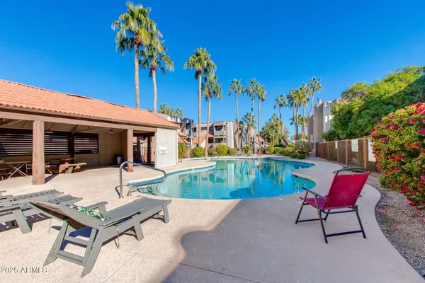 a view of a house with pool yard and a slide