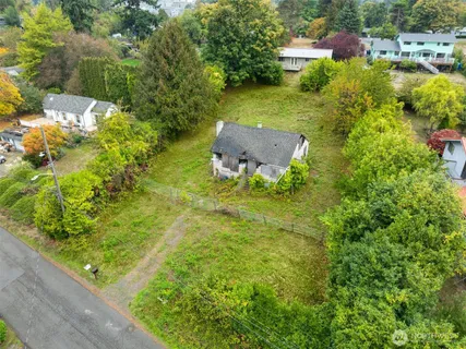 a backyard of a house with a yard and fountain