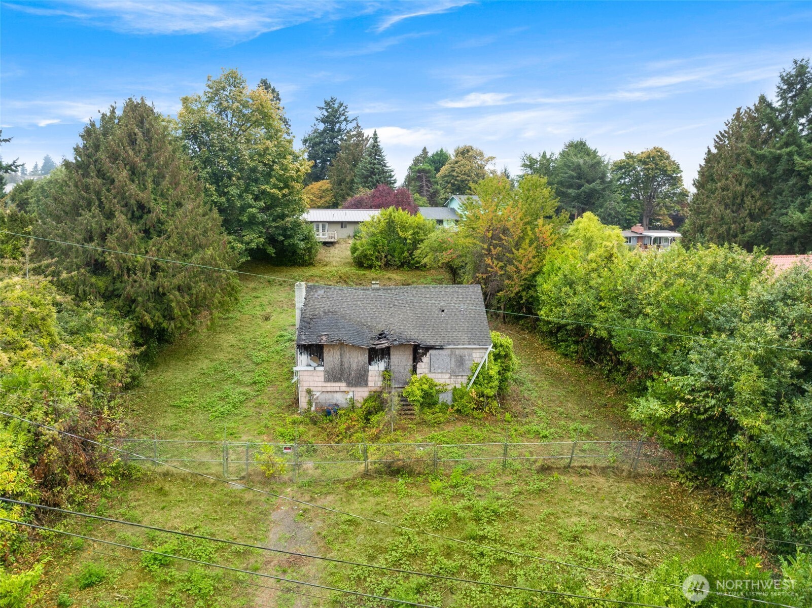 7652 South 135th Street Seattle, WA 98178 - Photo 9 of 12 a aerial view of a house with yard and outdoor seating