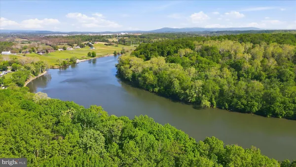 a view of a lake with houses in the back
