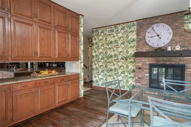 a room with wooden floor and a chair