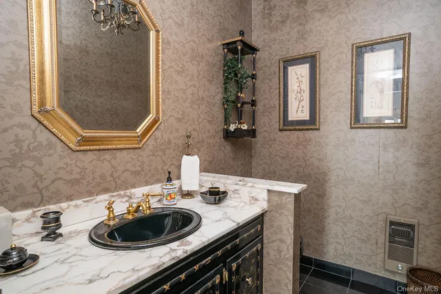 a bathroom with a sink a vanity and a mirror