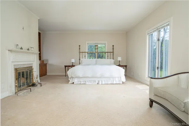 a bedroom with a bed and a fireplace