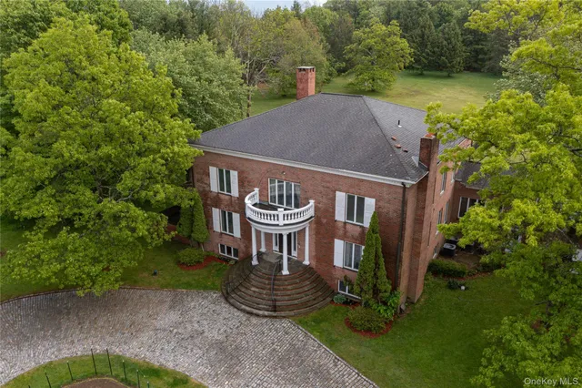 a view of a house with garden entrance and a small yard