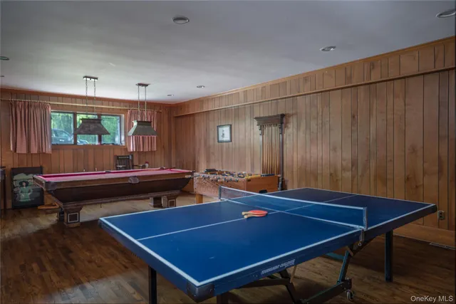 a room with furniture and pool table