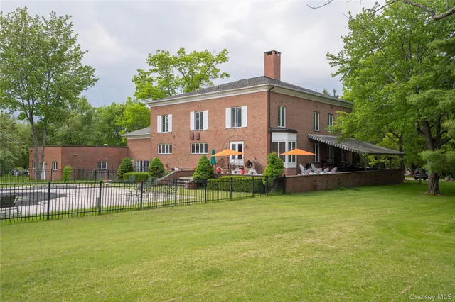 a view of a house with a swimming pool