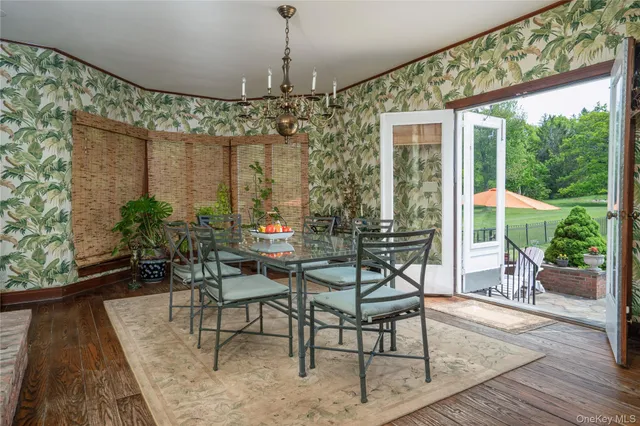 a view of a dining room with furniture window and outside view