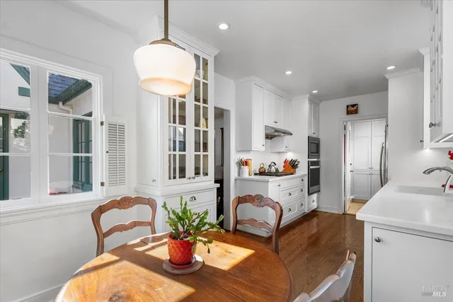 a living room with furniture potted plant and a window