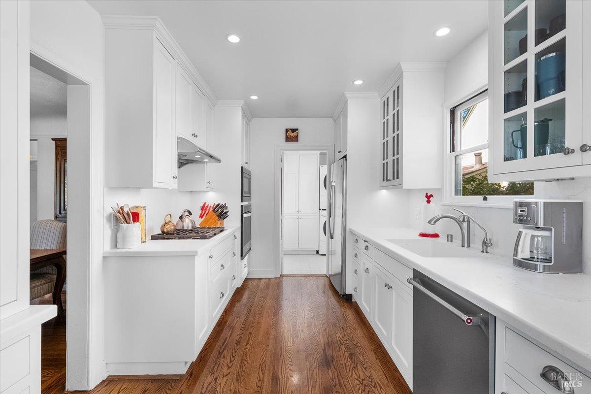 1805 Austin Way Santa Rosa, CA 95404 - Photo 15 of 46 a kitchen with stainless steel appliances a sink a stove a refrigerator cabinets and a dining table
