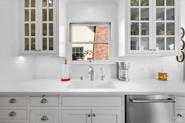 a bathroom with a sink and a window