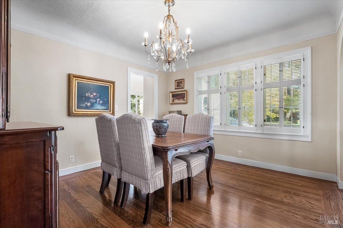 1805 Austin Way Santa Rosa, CA 95404 - Photo 22 of 46 a view of a dining room with furniture a chandelier and wooden floor