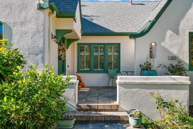 front view of a house with potted plants