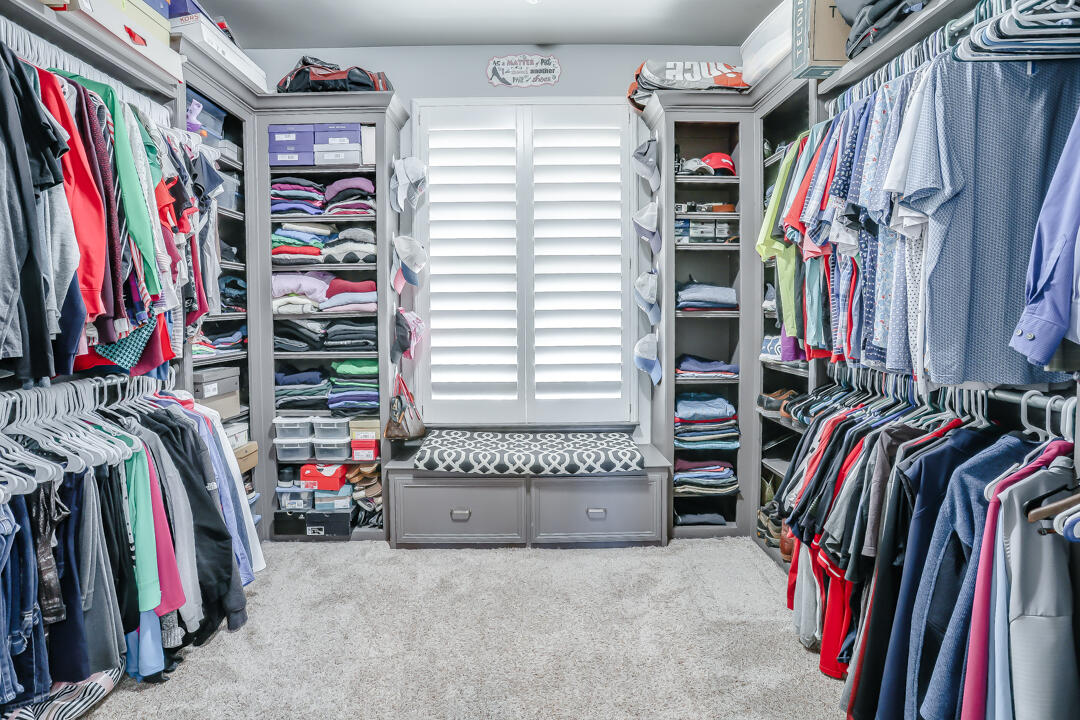 4712 121st Street Lubbock, TX 79424 - Photo 19 of 46 a view of walk in closet with clothes