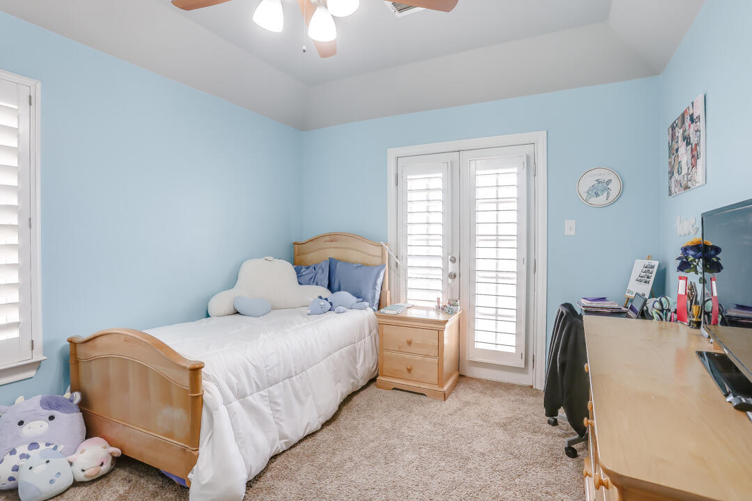 4712 121st Street Lubbock, TX 79424 - Photo 24 of 46 a bedroom with a bed and a window