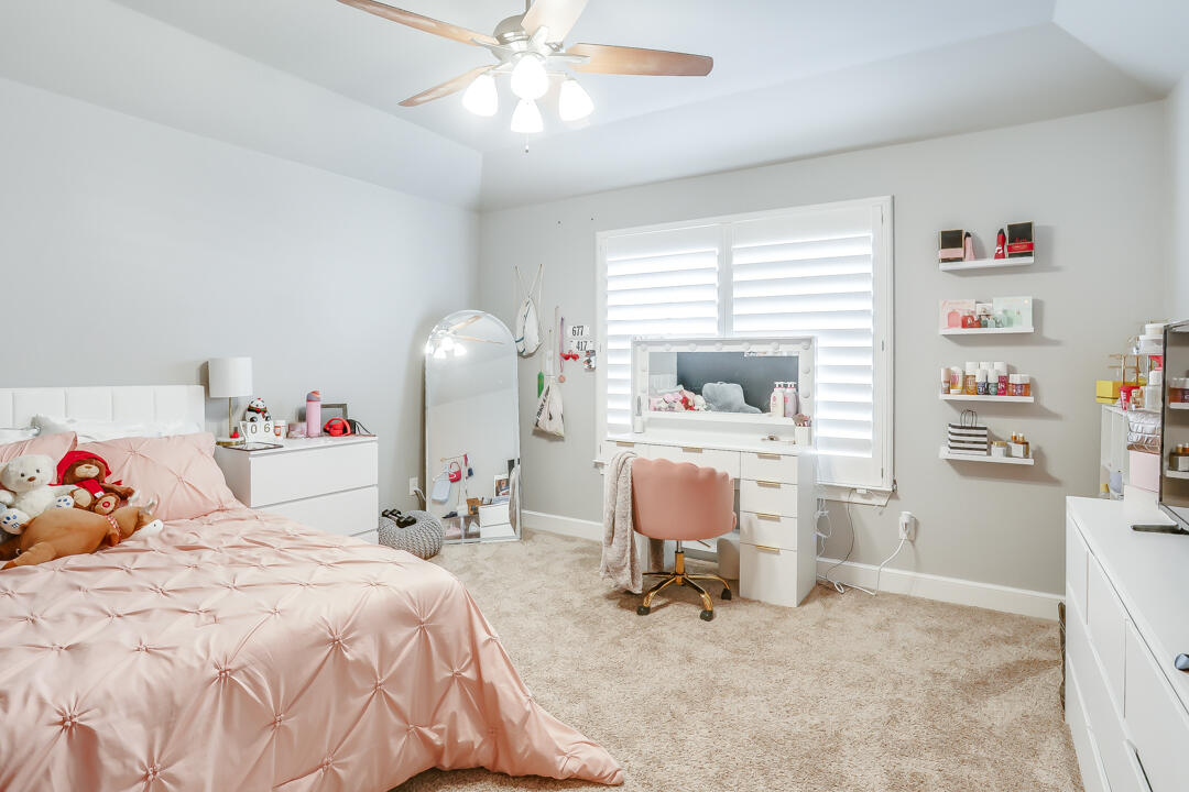 4712 121st Street Lubbock, TX 79424 - Photo 25 of 46 a bedroom with a bed and a window