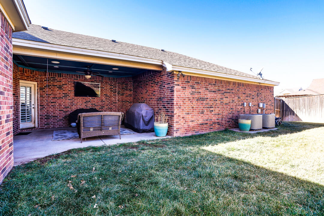4712 121st Street Lubbock, TX 79424 - Photo 34 of 46 a front view of a house with patio