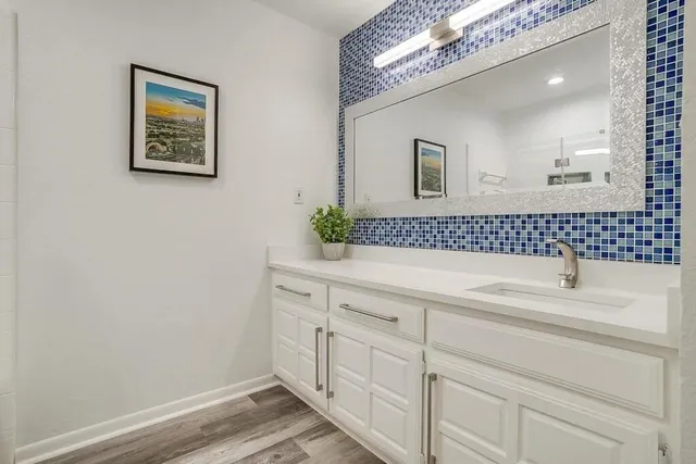 a bathroom with a sink and a mirror