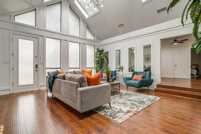 a living room with furniture and a large window