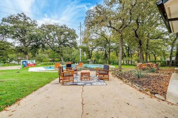 a view of a table and chairs in the garden
