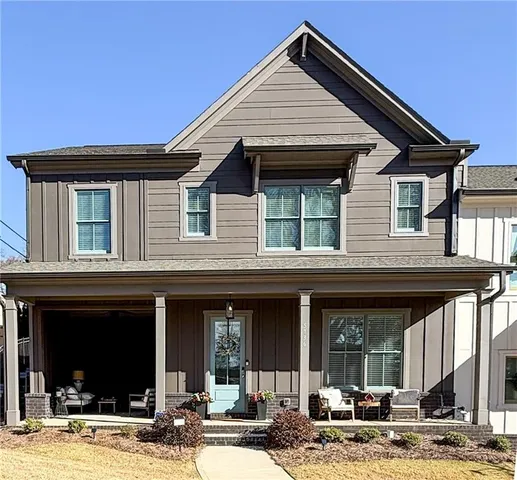a front view of a house with glass windows