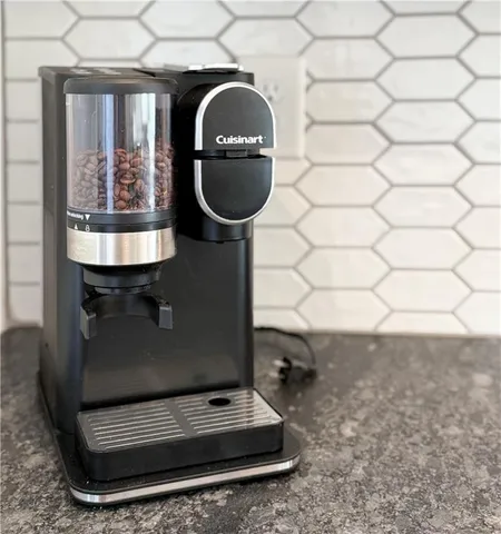 a room with water heater and a wooden floor