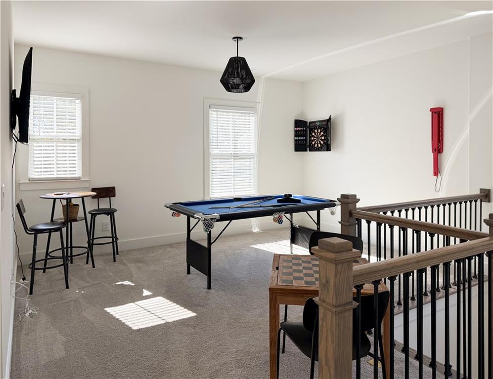 5736 Main Street Flowery Branch, GA 30542 - Photo 15 of 30 a living room with furniture and a window