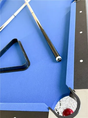a wooden floor with a chair and potted plant