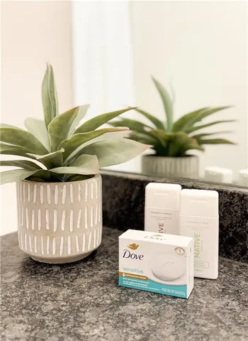 a bedroom with a bed and couch